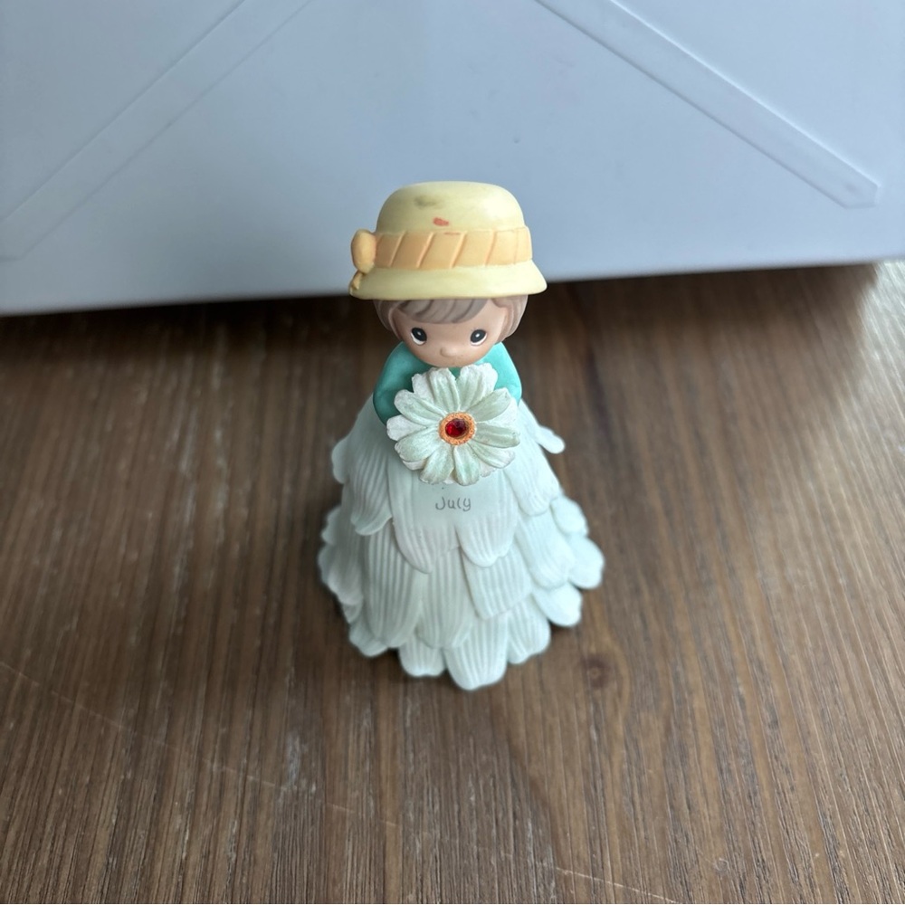 Charming Figurine with Flower and Hat